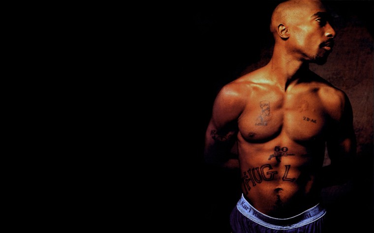 Tupac Shakur with Thug Life tattoo